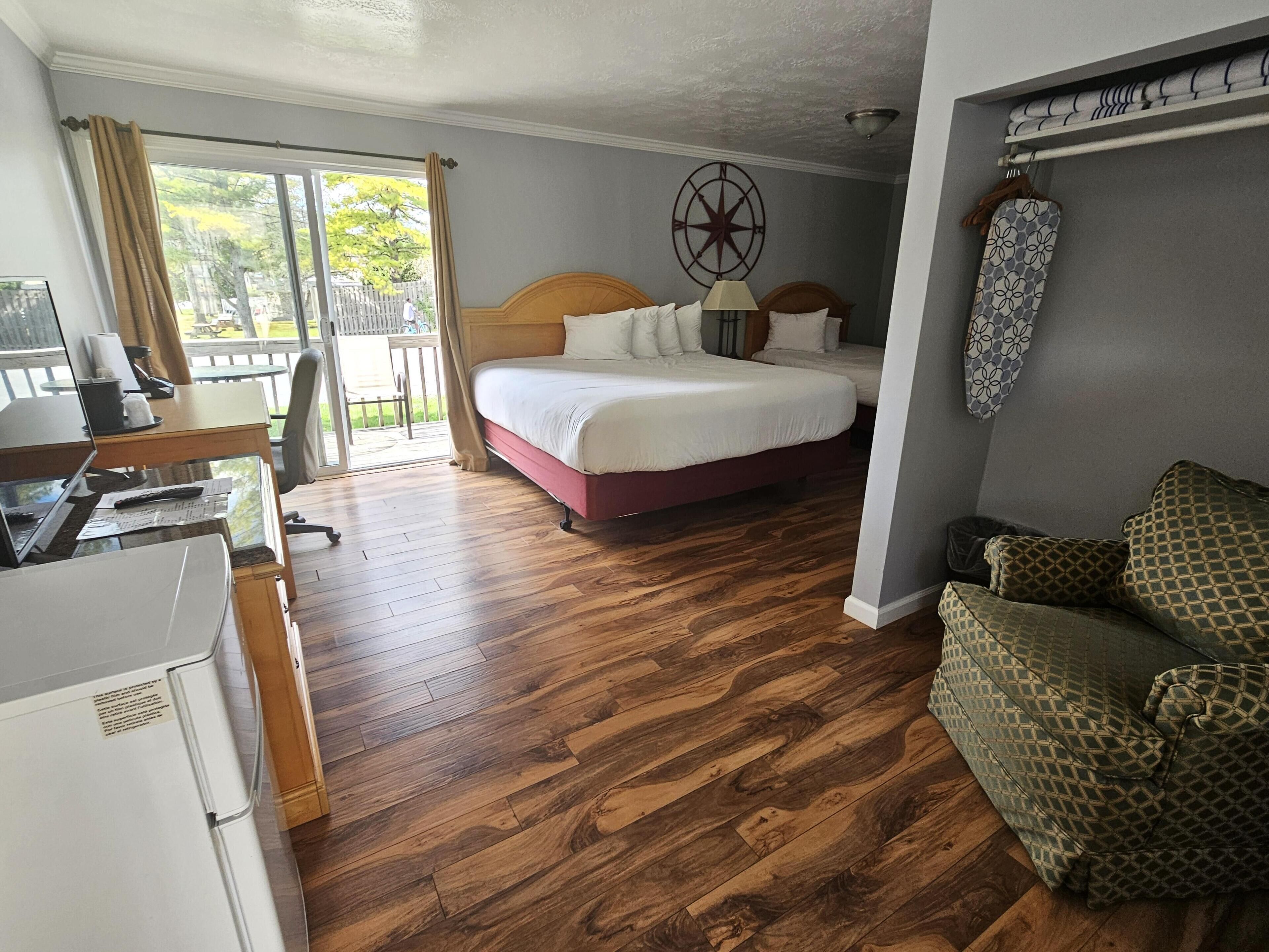 1 king & 1 full bed with kitchenette and deck | living area | 32-inch flat-screen tv with cable channels, tv