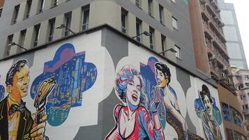 A building with a mural of Marilyn Monroe and other figures.