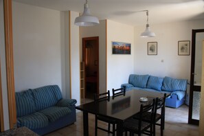 Economy Apartment, 2 Bedrooms | Living area | TV