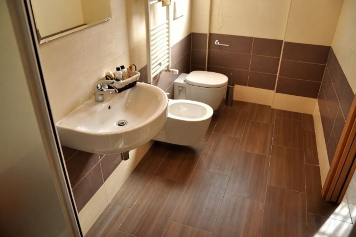 Bathroom | Shower, rainfall showerhead, hair dryer, bidet