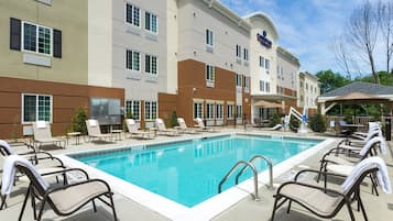 Seasonal outdoor pool, open 8:00 AM to 9:00 PM, pool loungers