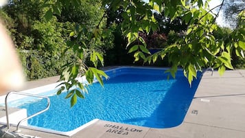 Seasonal outdoor pool, pool loungers