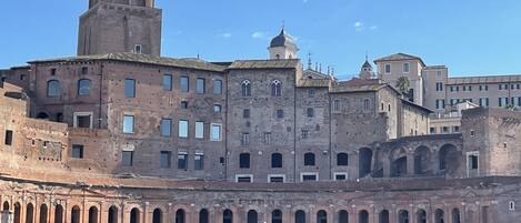 A historic building with multiple arches and a prominent tower.