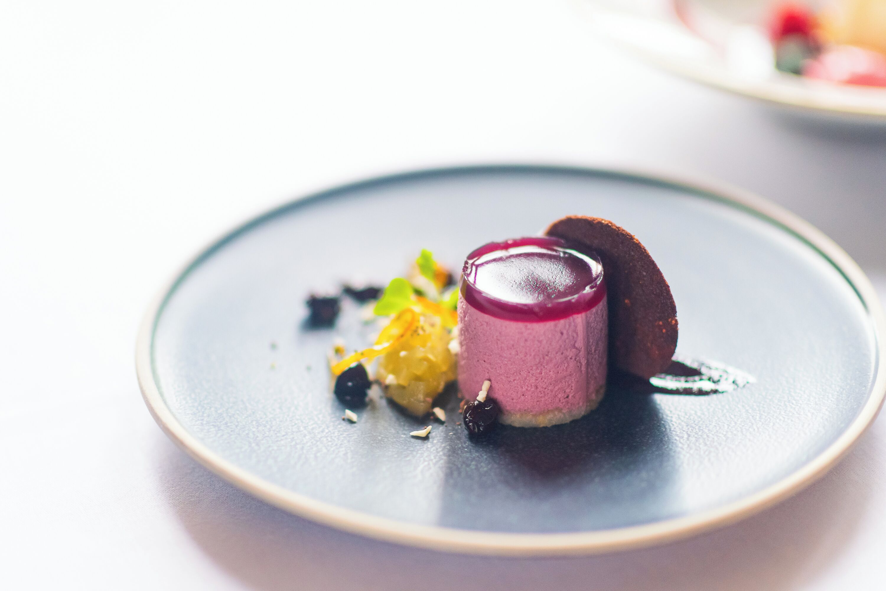 A dessert on a plate with a dark background.