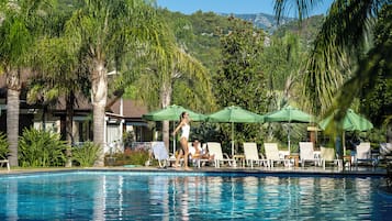 Seasonal outdoor pool, pool umbrellas, pool loungers