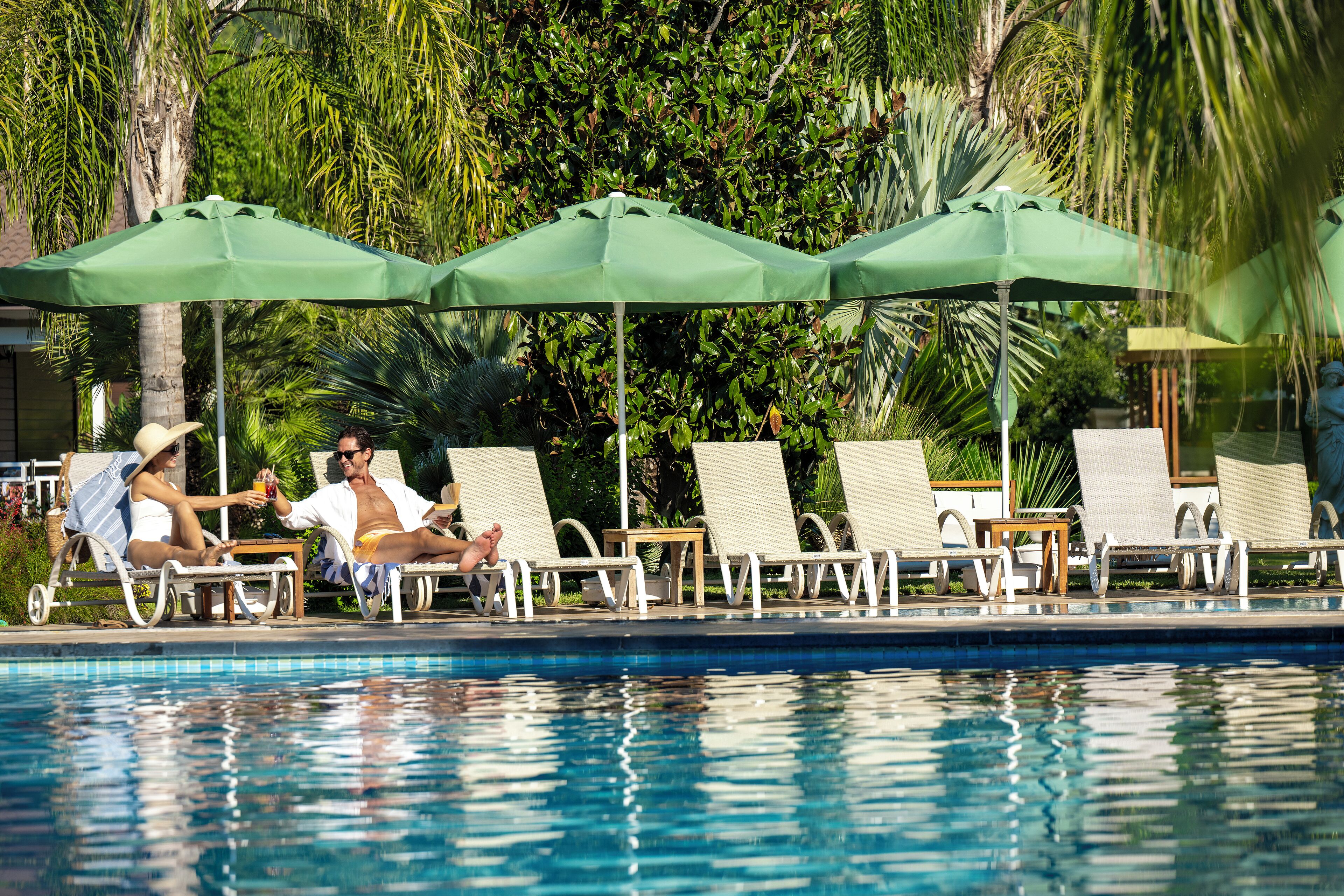 seasonal outdoor pool, pool umbrellas, pool loungers