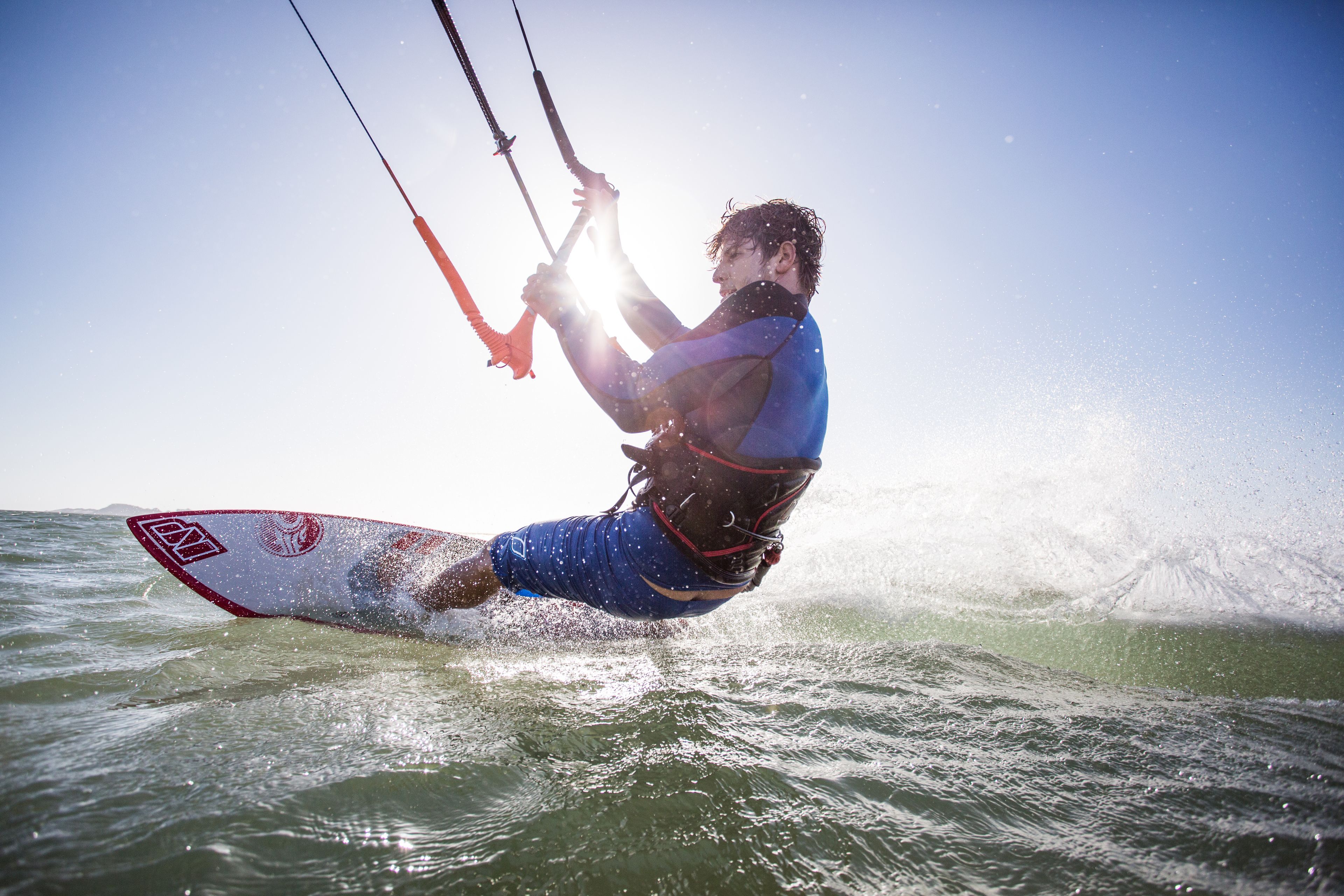 A person kiteboarding on the water.