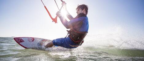 A person kiteboarding on the water.