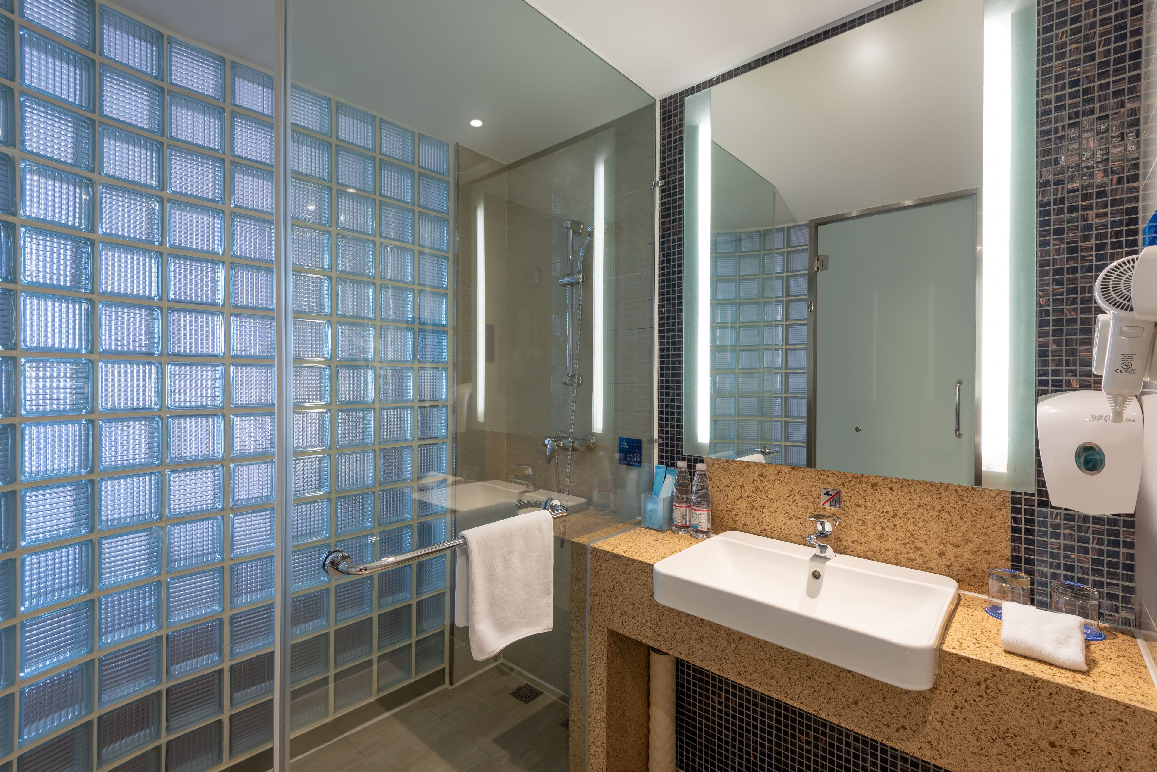 Shower, hair dryer, slippers, towels