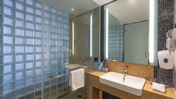 Shower, hair dryer, slippers, towels