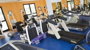 A gym with treadmills, elliptical machines, and weight equipment. - Hotel Novarello  (Granozzo con Monticello)