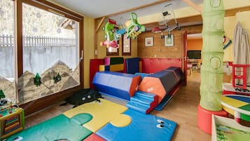 Children can play and climb on the foam mats and play structures in this fun playroom.