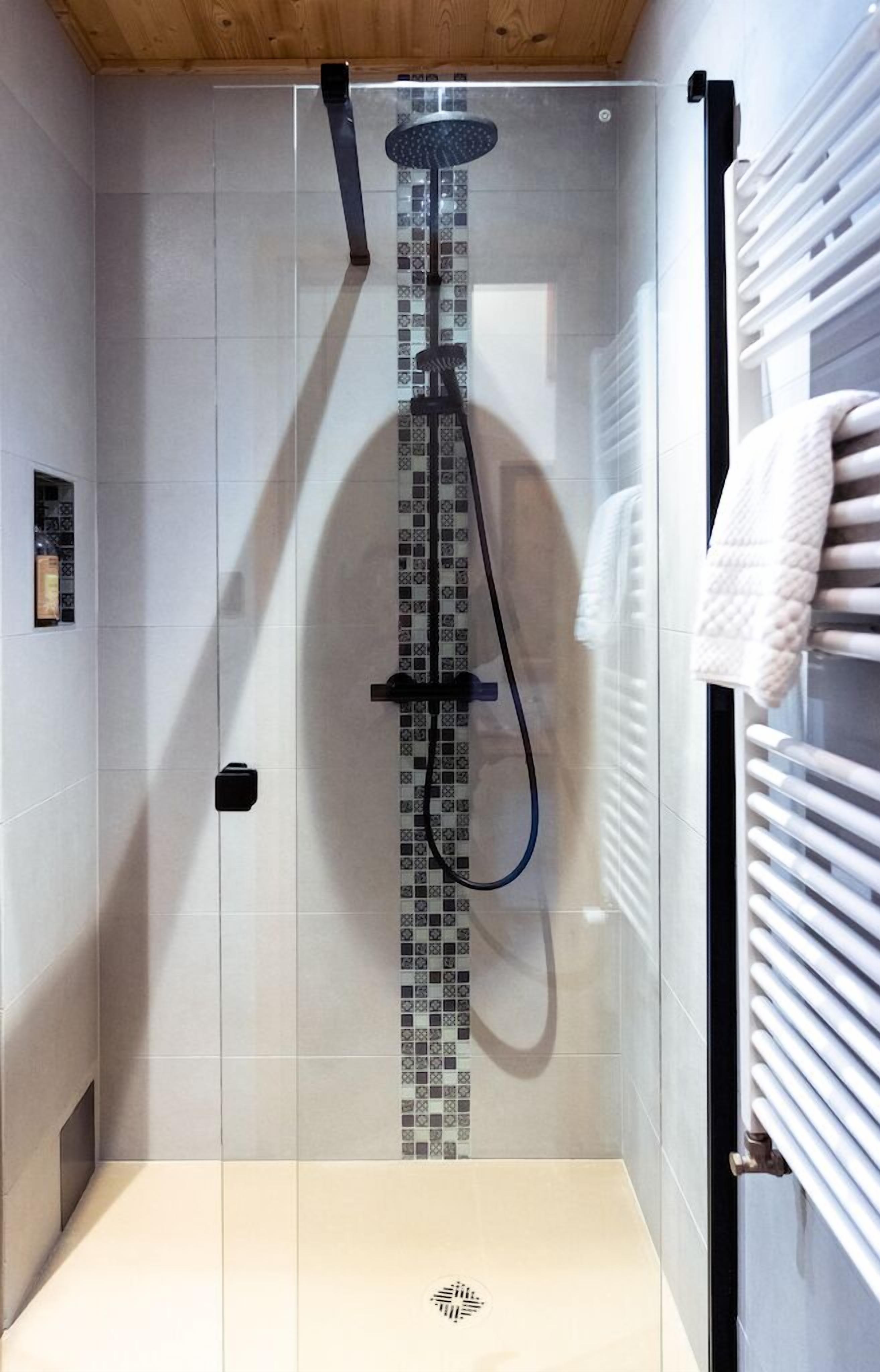 premier apartment | bathroom | rainfall showerhead, free toiletries, hair dryer, bathrobes