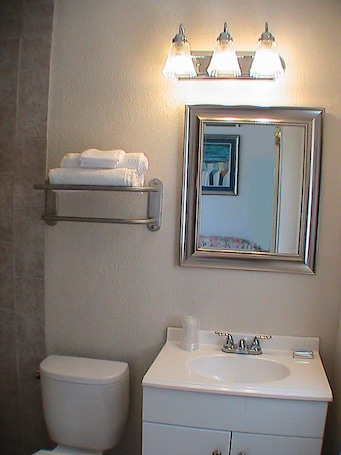 Shower, free toiletries, hair dryer, towels. At Home Express Tangerine Inn