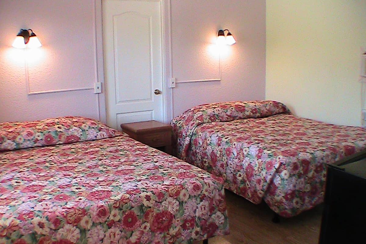 Double Queen Kitchenette | Premium bedding, memory foam beds, free WiFi, bed sheets