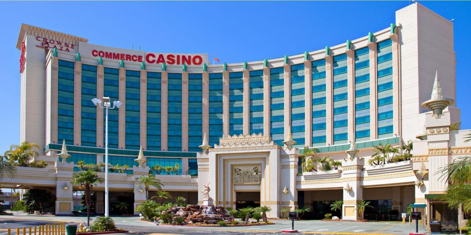 A large, multi-story building with a prominent sign reading "Commerce Casino."