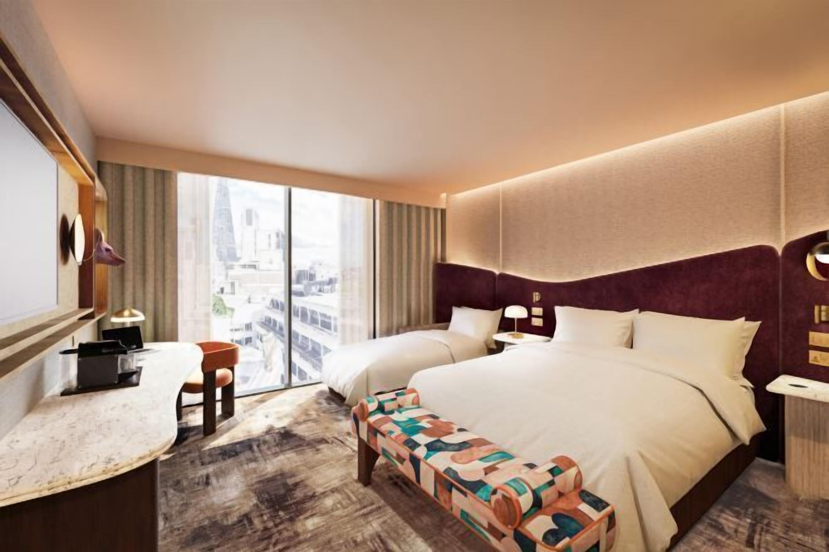 Ylelliset vuodevaatteet, tallelokero huoneessa, työpöytä