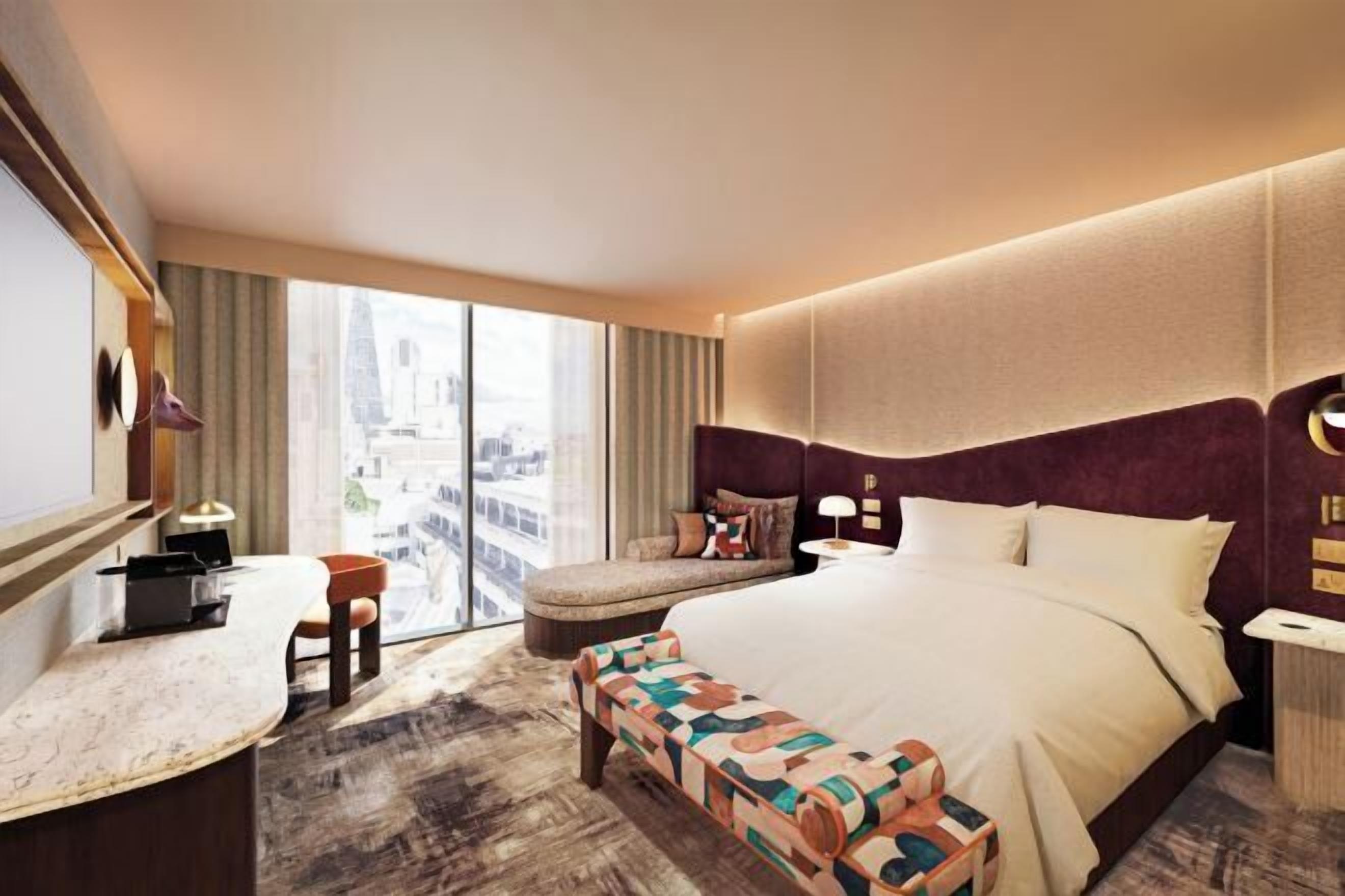 Ylelliset vuodevaatteet, tallelokero huoneessa, työpöytä