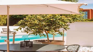 Outdoor pool, open 8:00 AM to 10:00 PM, sun loungers