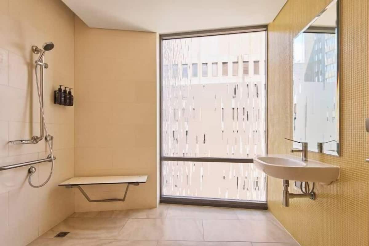 Bathroom | Shower, designer toiletries, hair dryer, towels