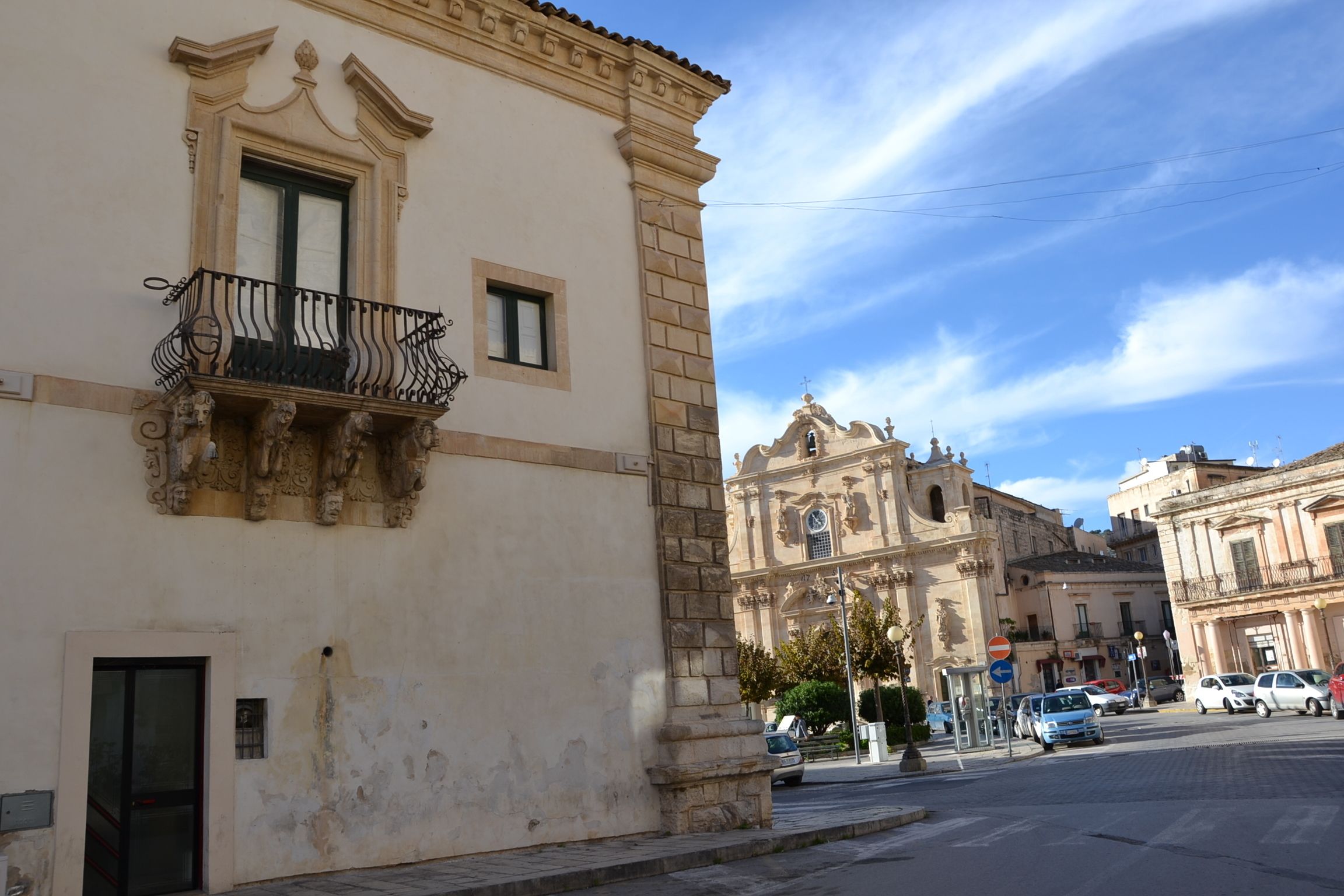 A historic building with ornate balconies and a classic facade.