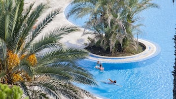 Indoor pool, pool umbrellas, pool loungers