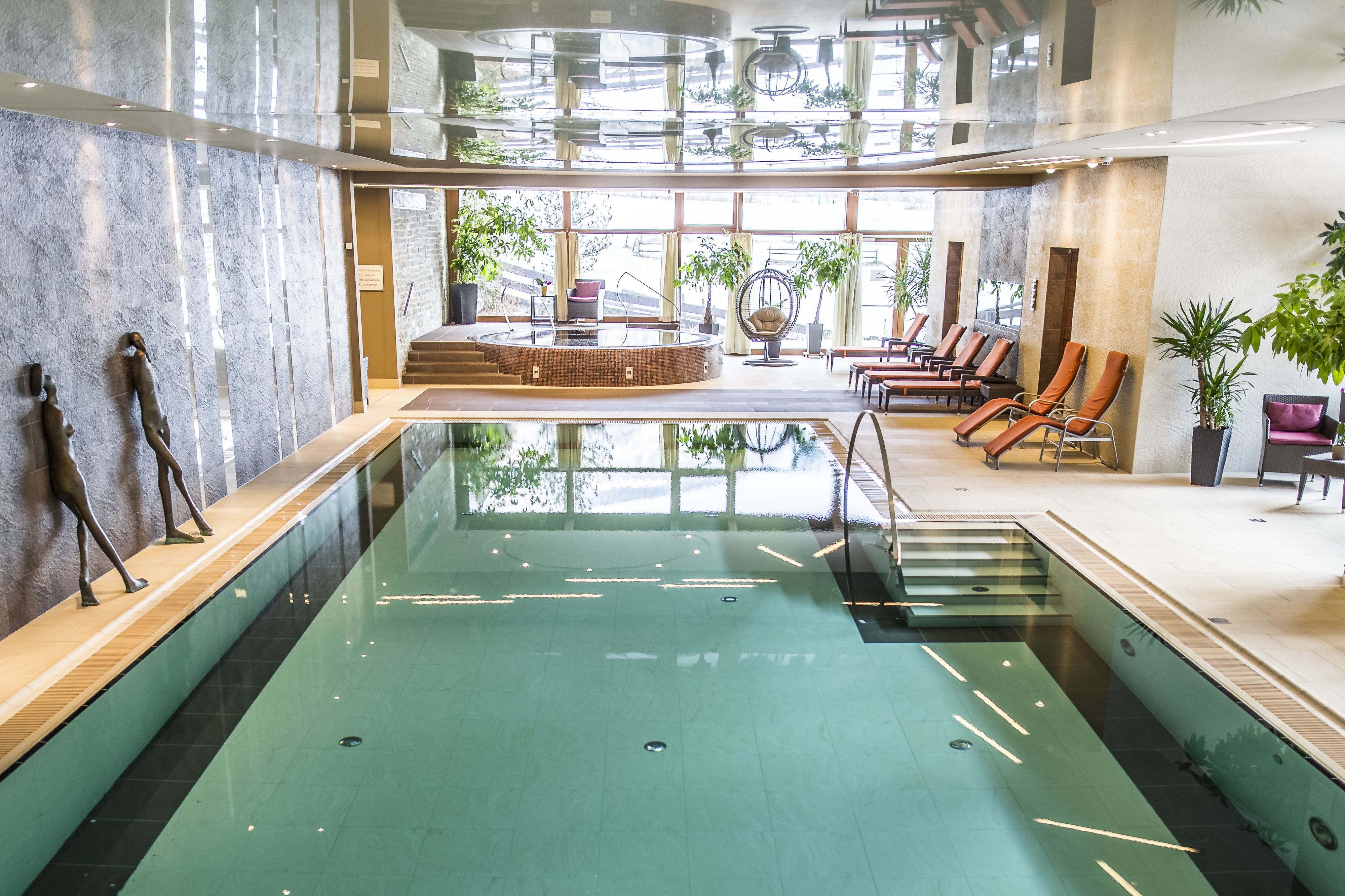 indoor pool, open 7:30 am to 7:00 pm, pool umbrellas, pool loungers