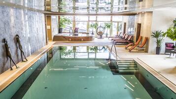 Indoor pool, open 7:30 AM to 7:00 PM, pool umbrellas, pool loungers