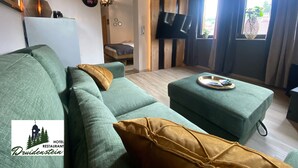 Luxury Suite, 1 King Bed, Sauna, Hill View | Living area - Hotel-Restaurant Druidenstein (Oberharz am Brocken)