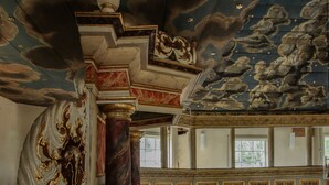 An ornate room with a high ceiling, detailed ceiling artwork, and a large window. - Hotel-Restaurant Druidenstein (Oberharz am Brocken)