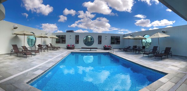 Outdoor pool, open 8:00 AM to 10:00 PM, pool loungers