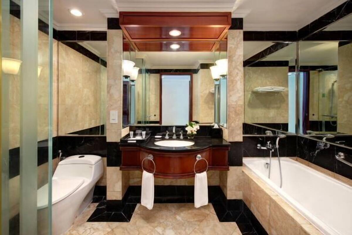 Separate tub and shower, free toiletries, hair dryer, slippers