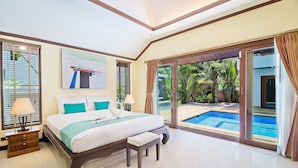 A spacious bedroom with a large bed, a bench, and a view of a swimming pool. - Tropicana Pool Villa (Pattaya)
