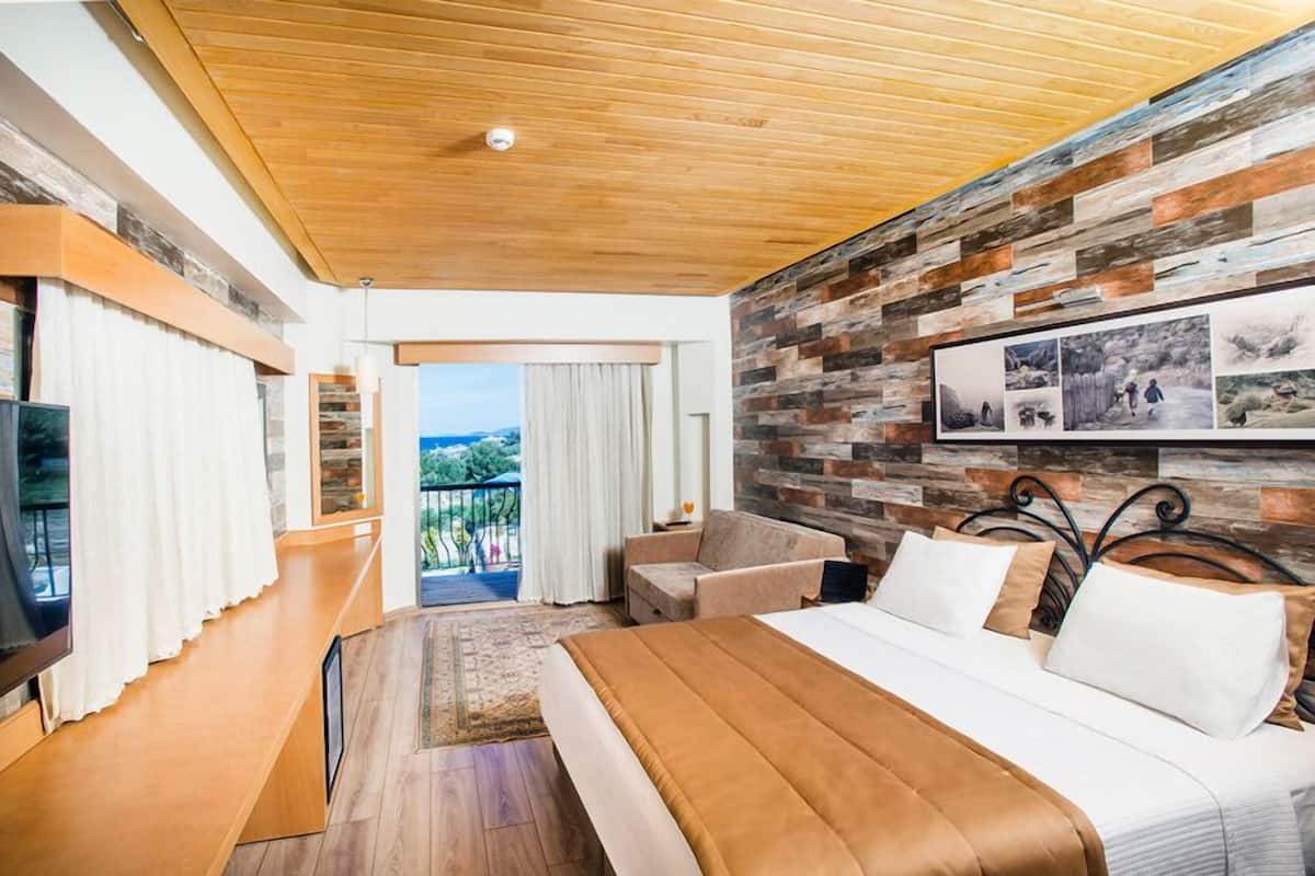 Suite Deluxe, vue mer | 1 chambre, literie de qualité supérieure, minibar