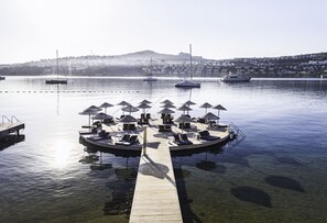 On the beach, sun-loungers, beach umbrellas, beach towels