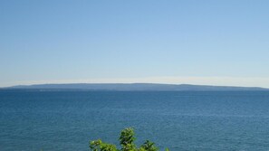 A coastal view with a clear sky and calm sea.