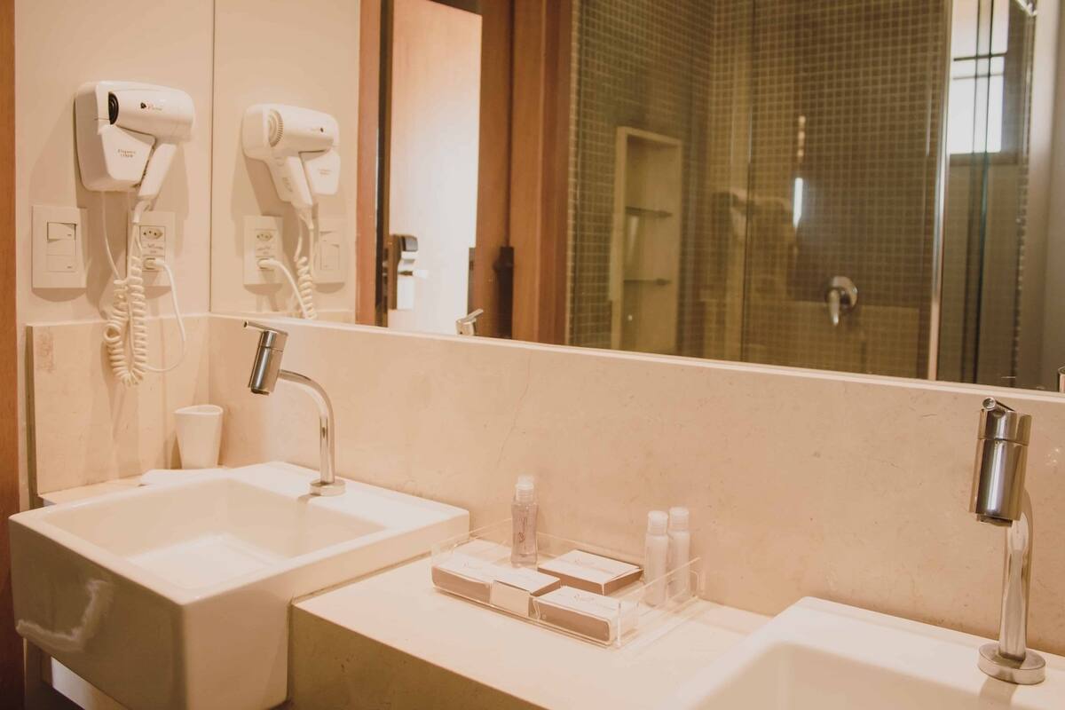 designer toiletries, hair dryer, towels, soap