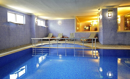 Indoor pool, outdoor pool, pool umbrellas, sun loungers