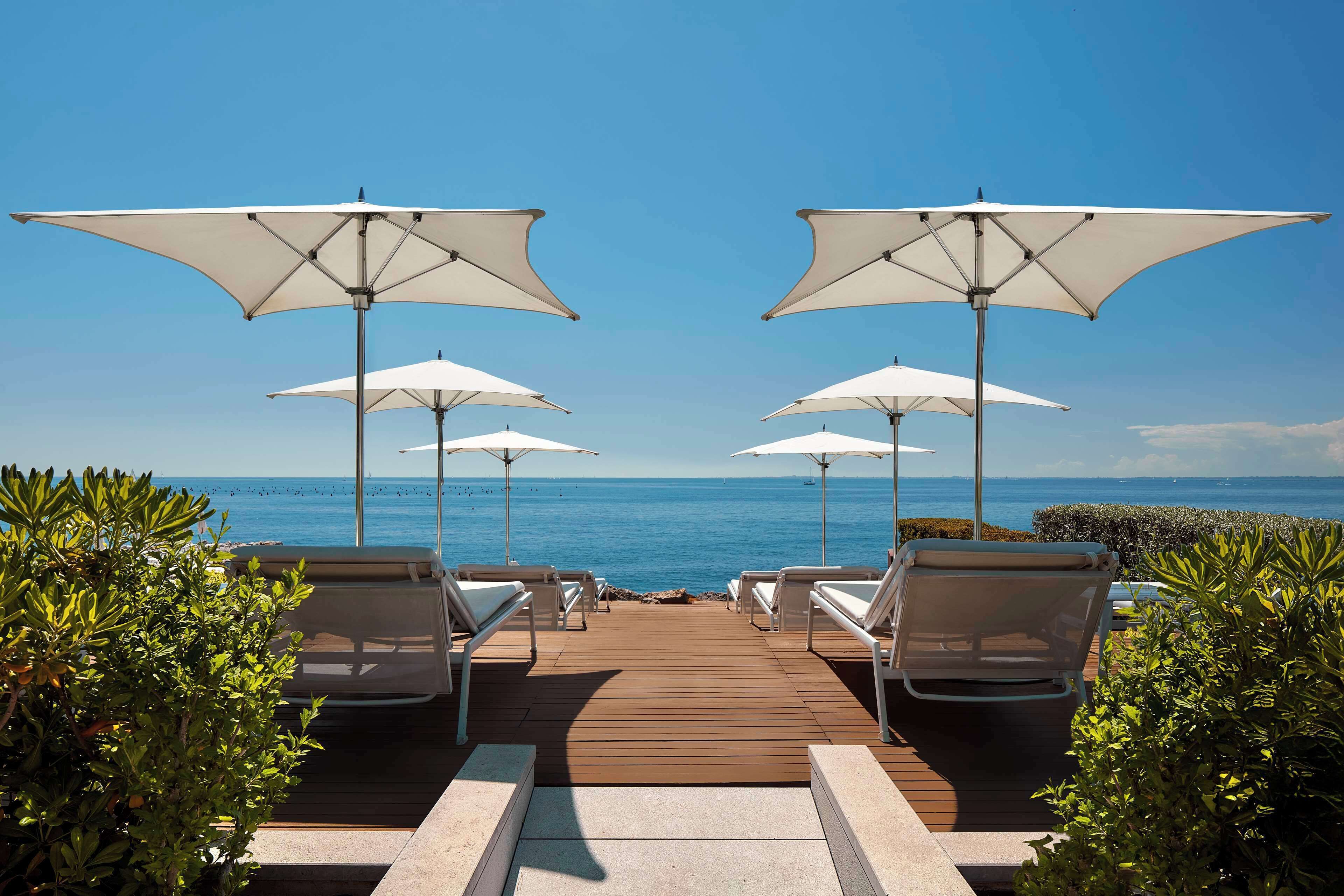 private beach, sun-loungers, beach umbrellas, beach towels