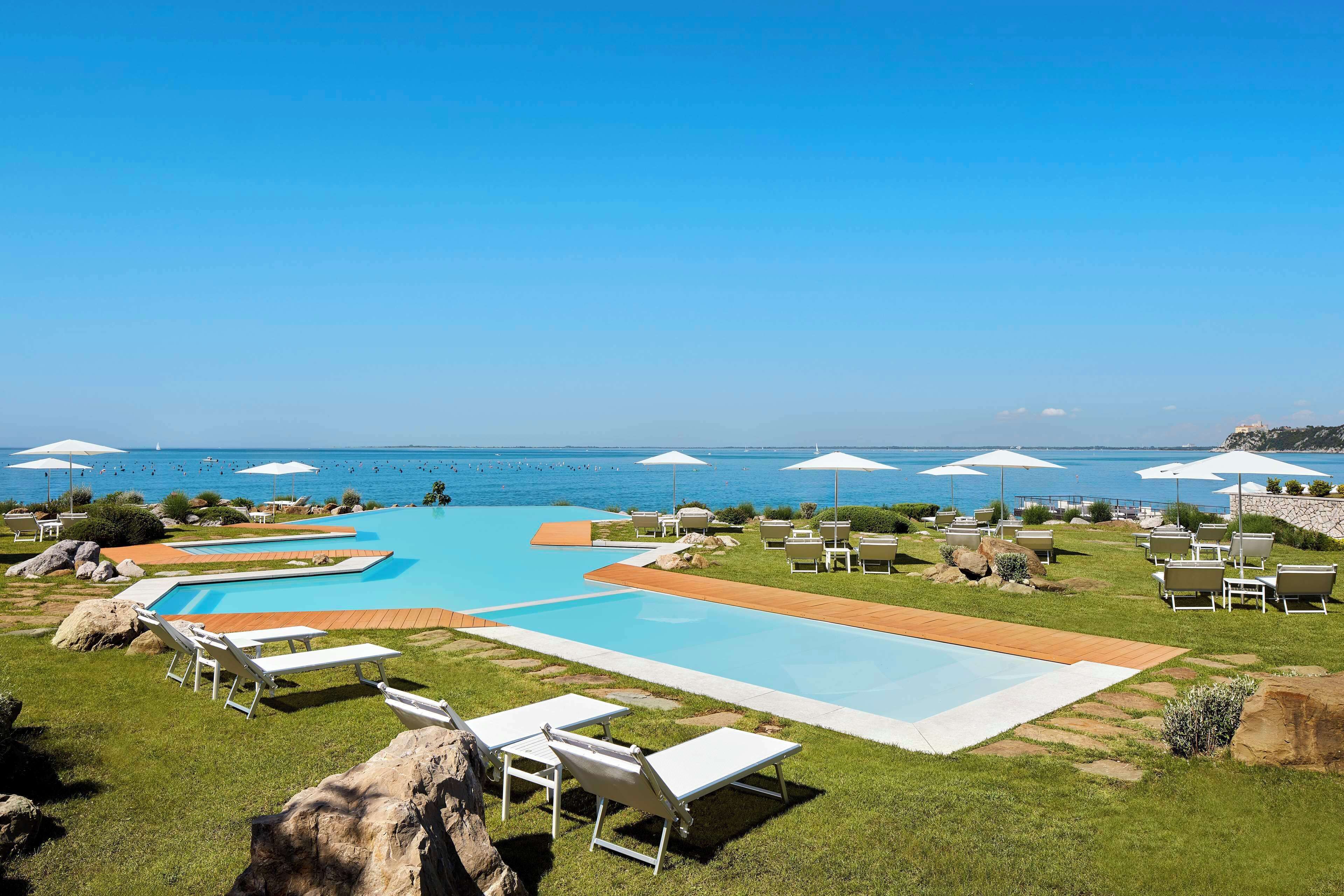 outdoor pool, pool umbrellas, pool loungers