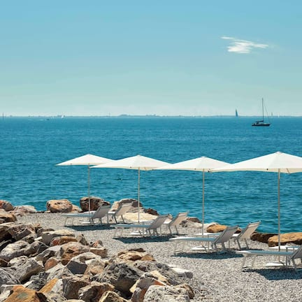 Private beach, sun loungers, beach umbrellas, beach towels