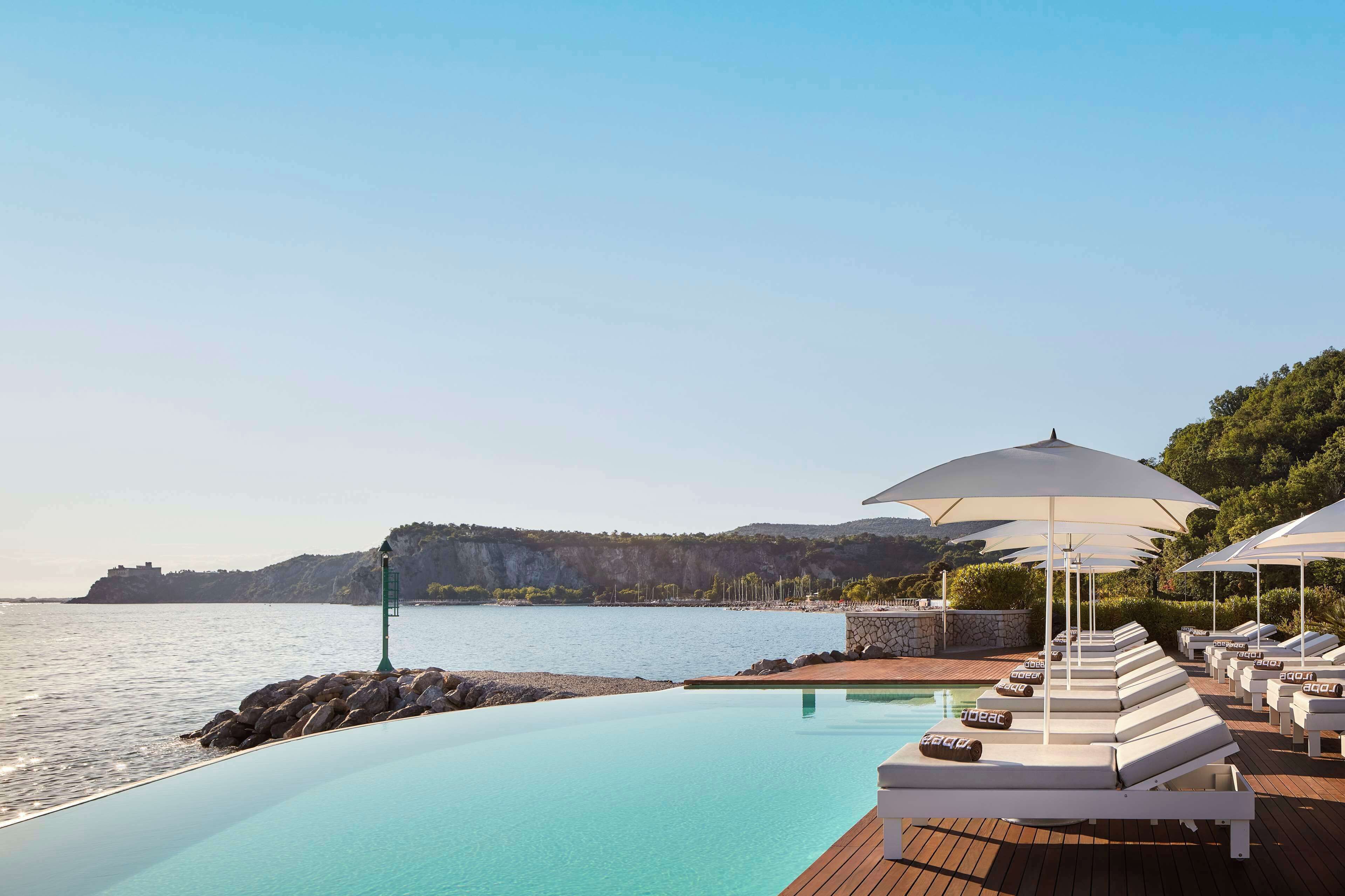 private beach, sun-loungers, beach umbrellas, beach towels