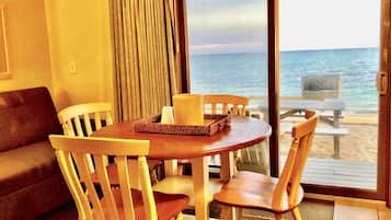 Beachfront Two Room Efficiency | Living area | 55-inch TV with cable channels