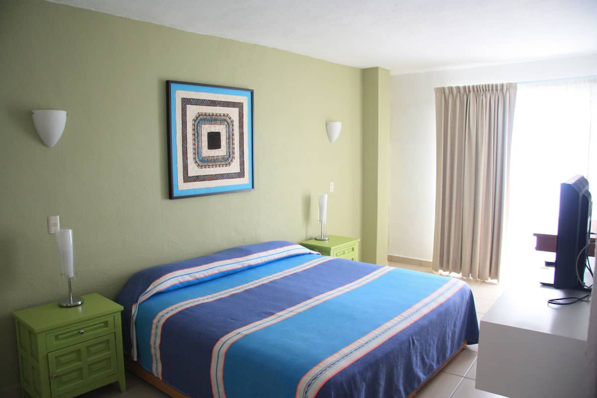 Apartment, 2 Bedrooms, Partial Ocean View | 1 bedroom, in-room safe, iron/ironing board, free WiFi