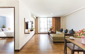 Executive Suite, 2 Bedrooms | Living room | 32-inch flat-screen TV with cable channels, TV - NY City Resort and Spa (Bang Sao Thong)