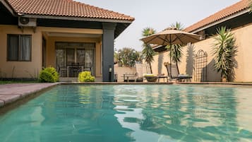 Outdoor pool, sun loungers