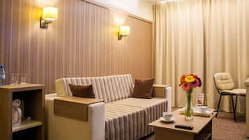 Family Suite, 1 Bedroom | Living area | Plasma TV