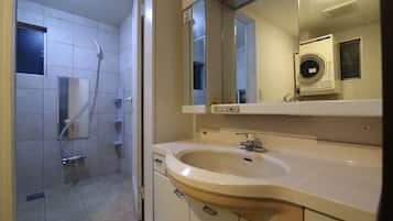 Shower, hair dryer, towels, shampoo