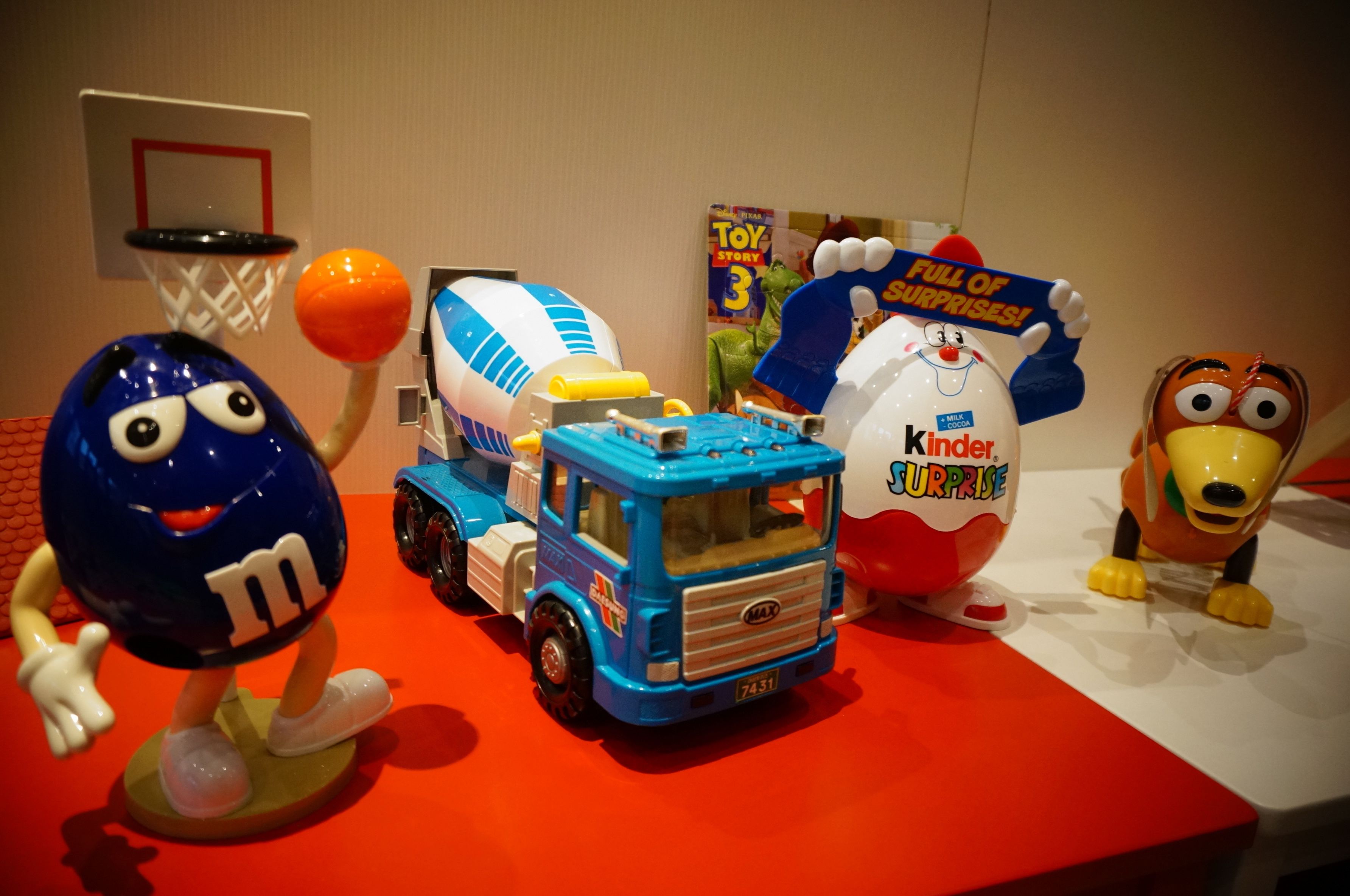 A display of various toys and a toy truck.