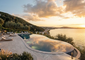 Outdoor pool, open 9:00 AM to 7:30 PM, pool umbrellas, pool loungers